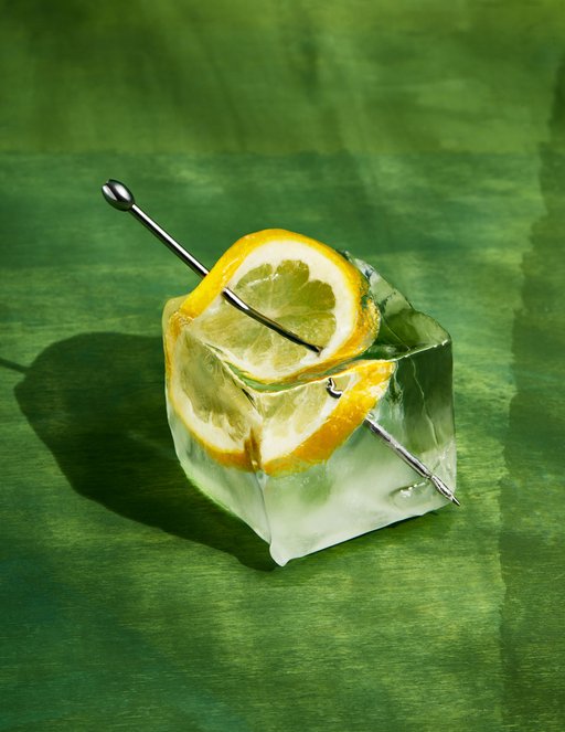 A stylized photo an lemon slice in an ice cube
